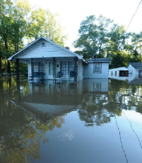 a house standing in flood waters