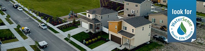 Image of a home from above showing surrounding lawns.