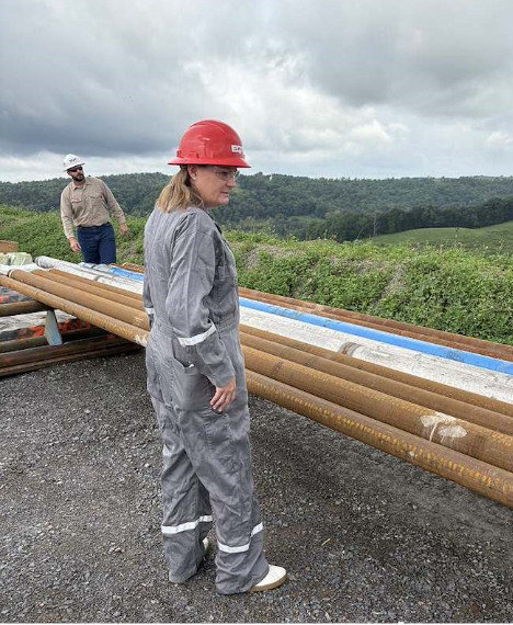 A woman looking out at a facility.