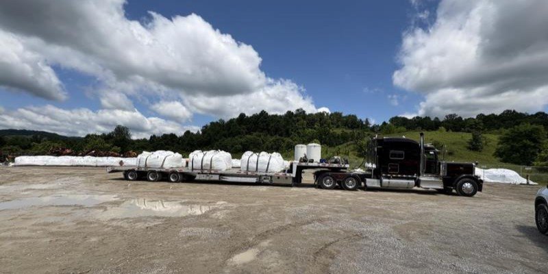 A truck packed with bags of amended sludges readies to leave the Fairmont Brine Site.
