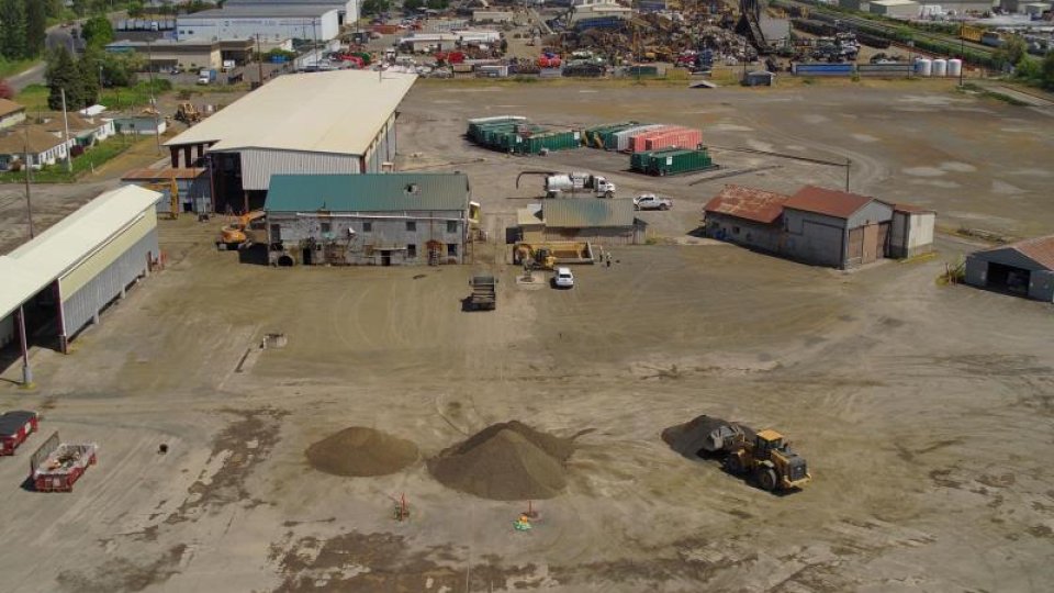 Mostly cleared dirt area where the former wood treating facility was located.