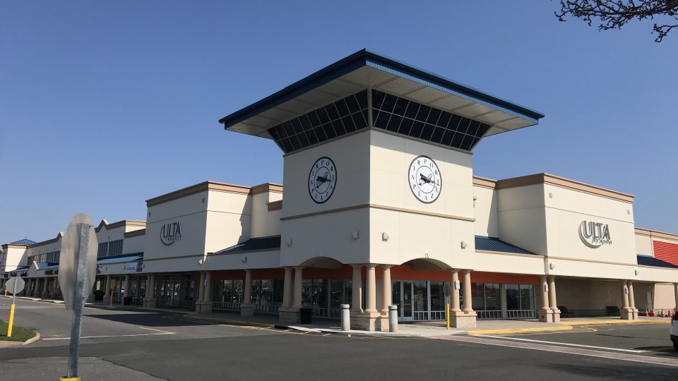 The parking lot and entrances for a newly-built shopping complex.