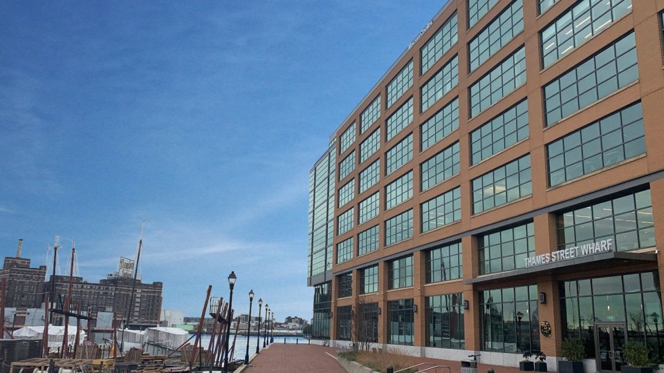 An office building next to a harbor.