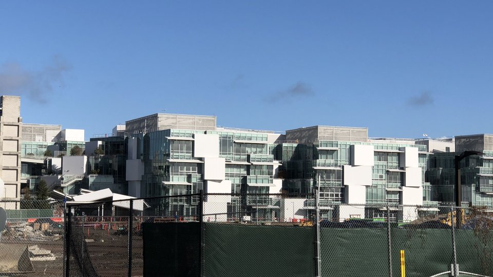 New glass buildings being built on construction site.
