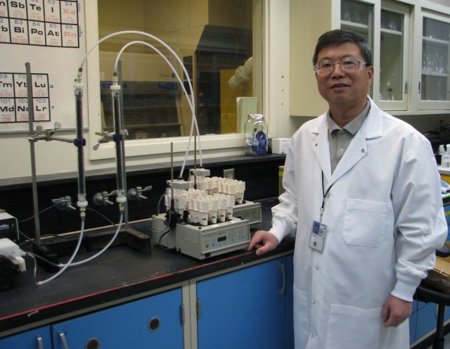 Chunming stands in a laboratory