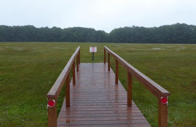 a deck overlooking a field