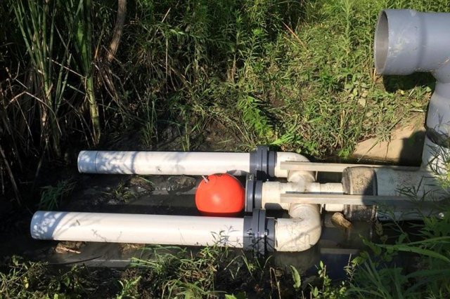 Detention Basin Retrofit that provides passive flow modification