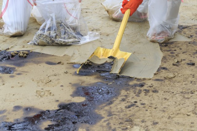 Shovel being used to remove contamination