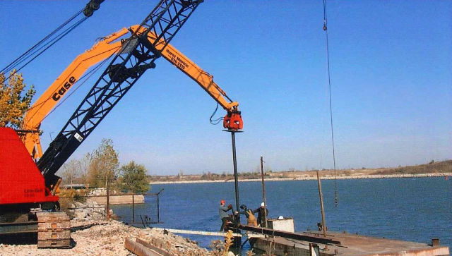 Driving initial sea wall sheet piles at North end of site