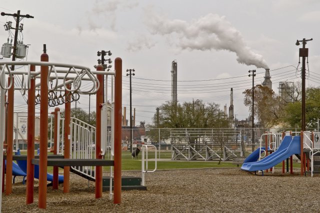 Playground near an industrial facility.