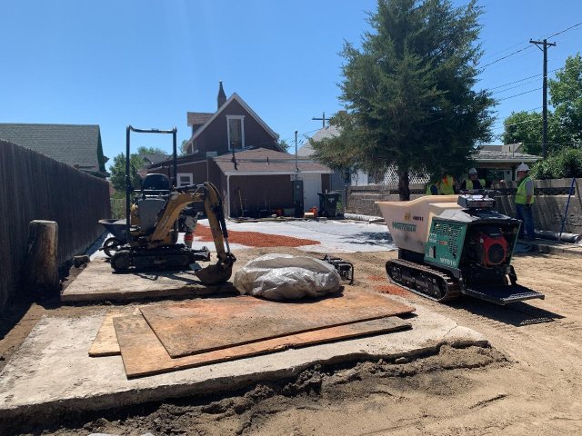 A construction site with a bulldozer and a construction vehicle.