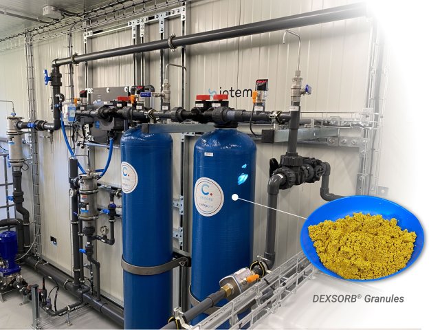 A group of pipes and machinery with a graphic showing the byproduct of the device