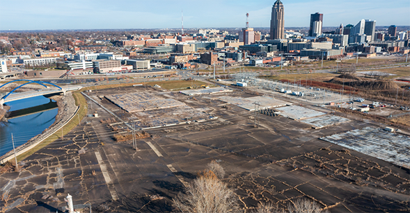 A protective cap at the Des Moines TCE Site, city buildings in the background.
