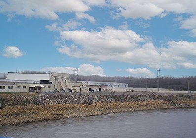 Dilapidated buildings next to a water body