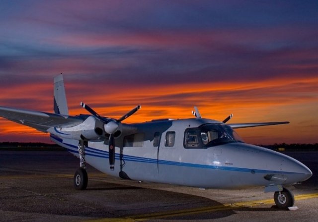 The ASPECT plane on the ground at sunset