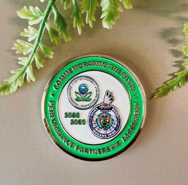 Challenge coin commemorating signage of the sixth Performance Partnership Agreement