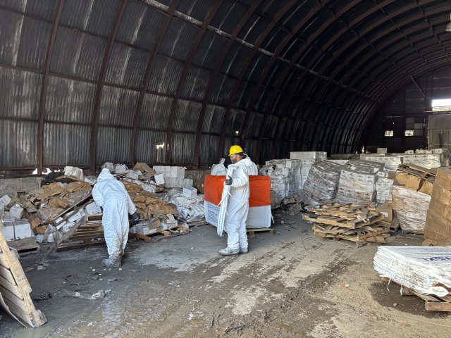 EPA contractors sorting material in the 3800 Highland Avenue warehouse.