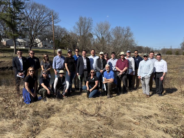 Group of people smiling in the field