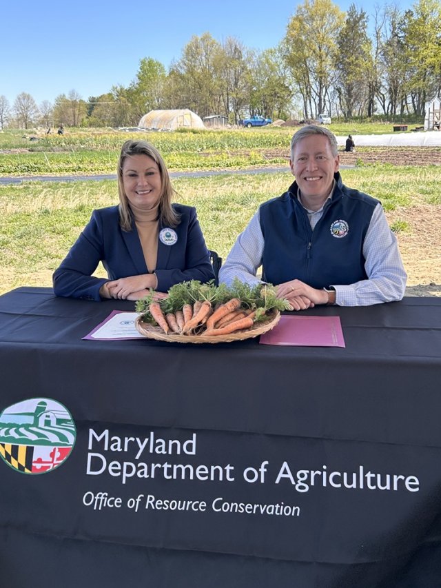 Officials pose after signing agreement.
