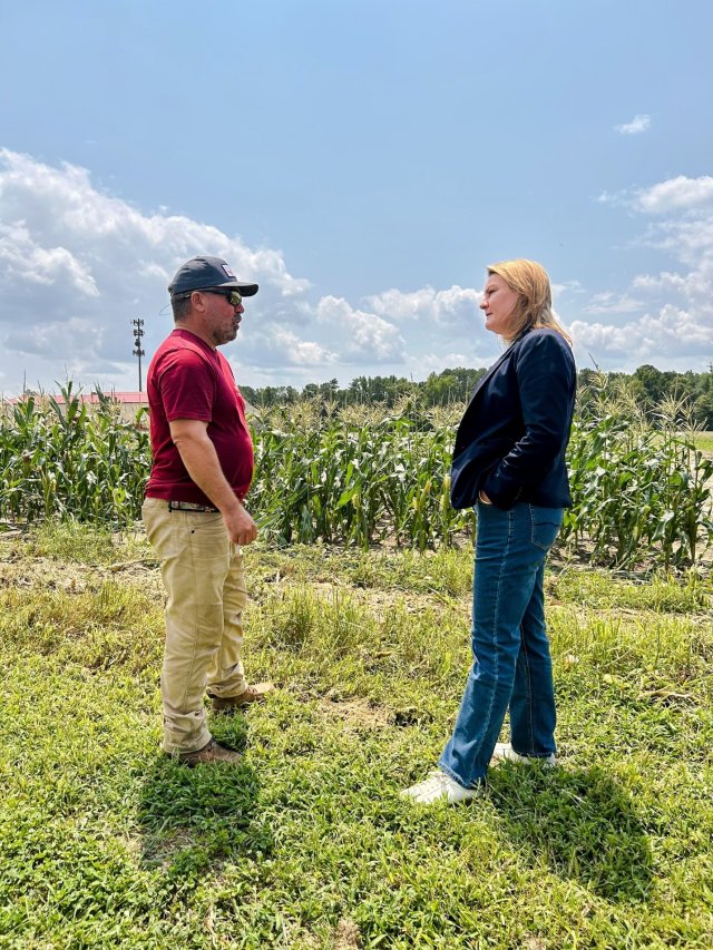 EPA Mid-Atlantic Regional Administrator Amy Van Blarcom-Lackey talks to farmer Grayson Kirby in front of his cornfield about regenerative agricultural practices. 
