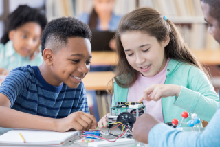 Students building a robot.