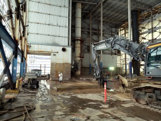 Interior of building 3 with biohazard suited worker.