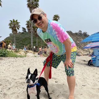 Jose Zambrana at beach with dog