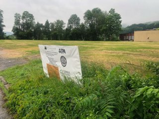 Brownfields funding banner sign at Robertson Paper Mill property