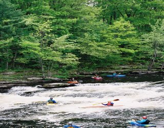 Kayakers at whitewater kayaking park