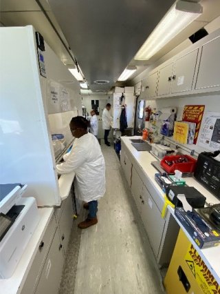 EPA contractors analyzing samples in the PHILIS lab.