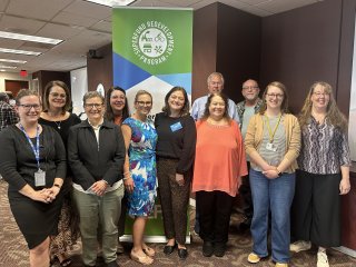 A group of people standing together under an EPA banner.