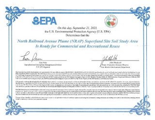 Certificate with the EPA logo at the top and two signatures in the middle of the page. The top of the certificate says "On this day, September 21, 2023, the U.S. Environmental Protection Agency (U.S. EPA) Determines that the North Railroad Avenue Plume (NRAP) Superfund Site Soil Study Area Is Ready for Commercial and Recreational Reuse." The remaining text on the certificate is too small to be legible.