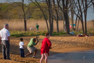 kids fishing and adults hanging out at Sandy Point State Park, mD