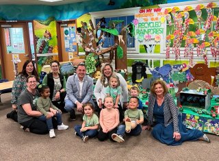 Regional Administrator Michael Martucci with students and educators at On My Way Early Learning and Childcare Center.