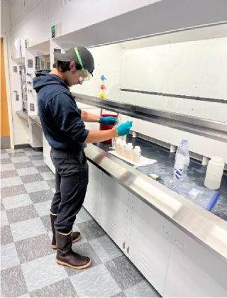Brian Pinkard looking at samples