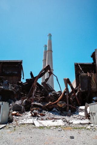The building that caught on fire is next to the smoke stacks formerly part of energy generation. The stacks are iconic locally.