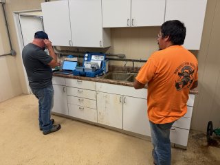David Rinaldi, EPA scientist, and Seymour Brant, Santee Sioux Tribal water operator, discuss disinfection of the Tribal water system.