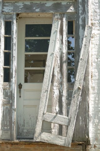A door and frame with peeling lead paint.