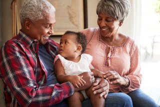 Grandparents with a grandkid in their lap