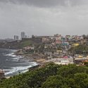 picture of a beach coastal town with stormy weather on the horizon
