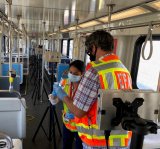 Image of EPA staff collecting samples from a bus for COVID19 UV disinfection studies