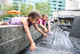 Children playing in a fountain