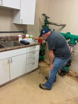 David Rinaldi, EPA scientist, takes readings of chemical levels in the Santee Sioux drinking water system to help understand the proper chlorine dosing levels.